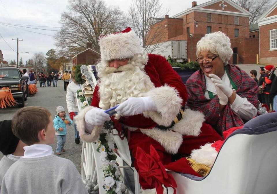 In downtown Hillsborough, the “Light Up The Night Hillsborough Holiday Parade, Community Sing and Tree Lighting” begins at 4 p.m. Sunday, Dec. 3. Santa and Mrs. Claus greet children at a previous parade.