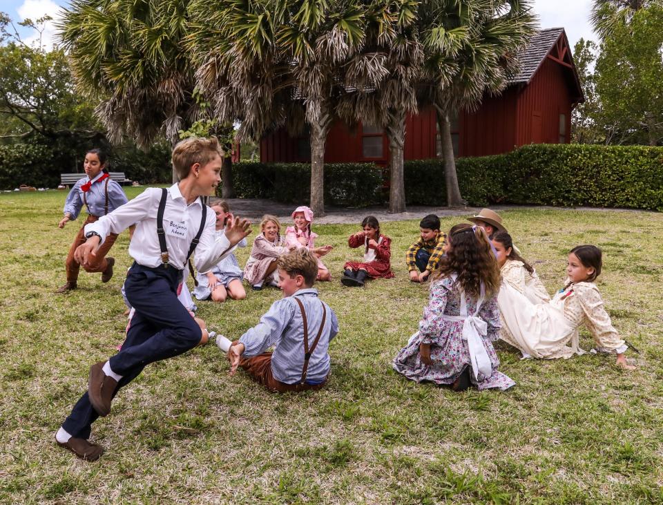 Rosarian Academy student Jasmine Lazzara chases Lachlan Throop while playing a game of duck-duck-goose with their classmates outside the Little Red Schoolhouse at Phipps Ocean Park in February. Plans to renovate the park are moving forward.