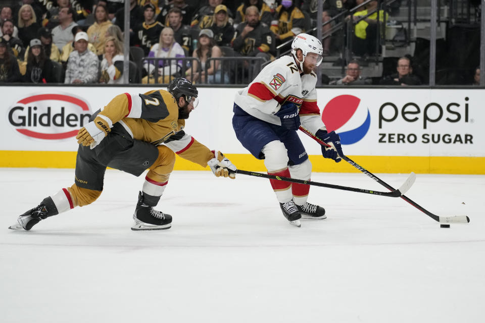 Florida Panthers center Eric Staal (12) breaks away to score as Vegas Golden Knights defenseman Alex Pietrangelo (7) defends during the first period of Game 1 of the NHL hockey Stanley Cup Finals, Saturday, June 3, 2023, in Las Vegas. (AP Photo/John Locher)