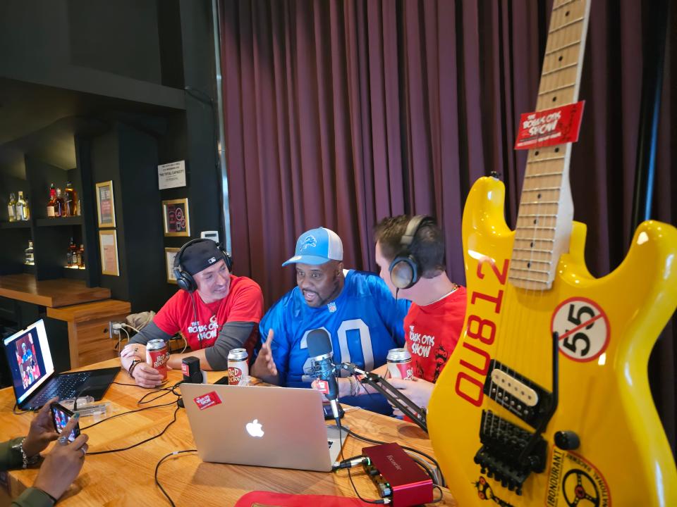 Detroit rapper Champtown (center) speaks with the hosts of "The Bogus Otis Show," a Sammy Hagar fan podcast, ahead of his show with Hagar at the Fillmore Detroit on Monday, Oct. 23, 2023.