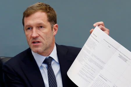 Minister-President of Wallonia Paul Magnette holds up notes during a debate on the Comprehensive Economic and Trade Agreement (CETA), a planned EU-Canada free trade agreement, at the Walloon regional parliament in Namur, Belgium October 21, 2016. REUTERS/Francois Lenoir