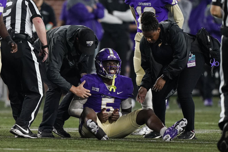 Western Carolina quarterback Carlos Davis (5) grimaces after an injury during the second half of the team's NCAA college football game against Georgia Tech, Saturday, Sept. 10, 2022, in Atlanta. (AP Photo/Brynn Anderson)