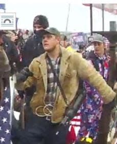 Joshua Doolin is seen in an image captured outside the U.S. Capitol on Jan. 6, according to an FBI affidavit.