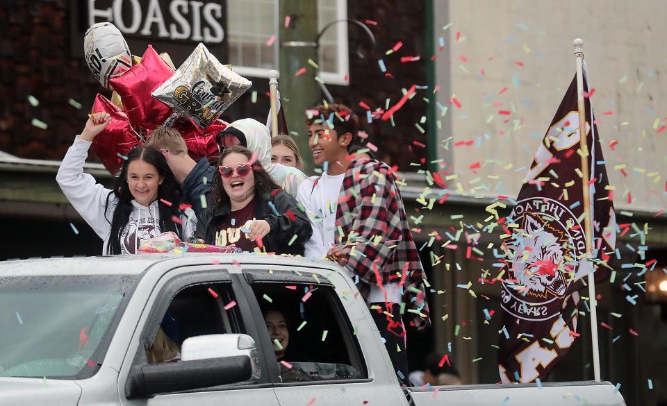 FILE IMAGE: A confetti canon is set off by a truckload of members of the South Kitsap Class of 2022 as they take part in the Senior Parade through downtown Port Orchard on Friday, June 10, 2022.