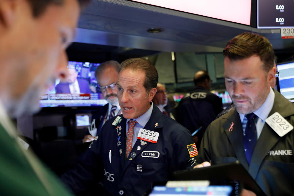 Traders work on the floor at the New York Stock Exchange (NYSE) in New York, U.S., September 18, 2019. REUTERS/Brendan McDermid