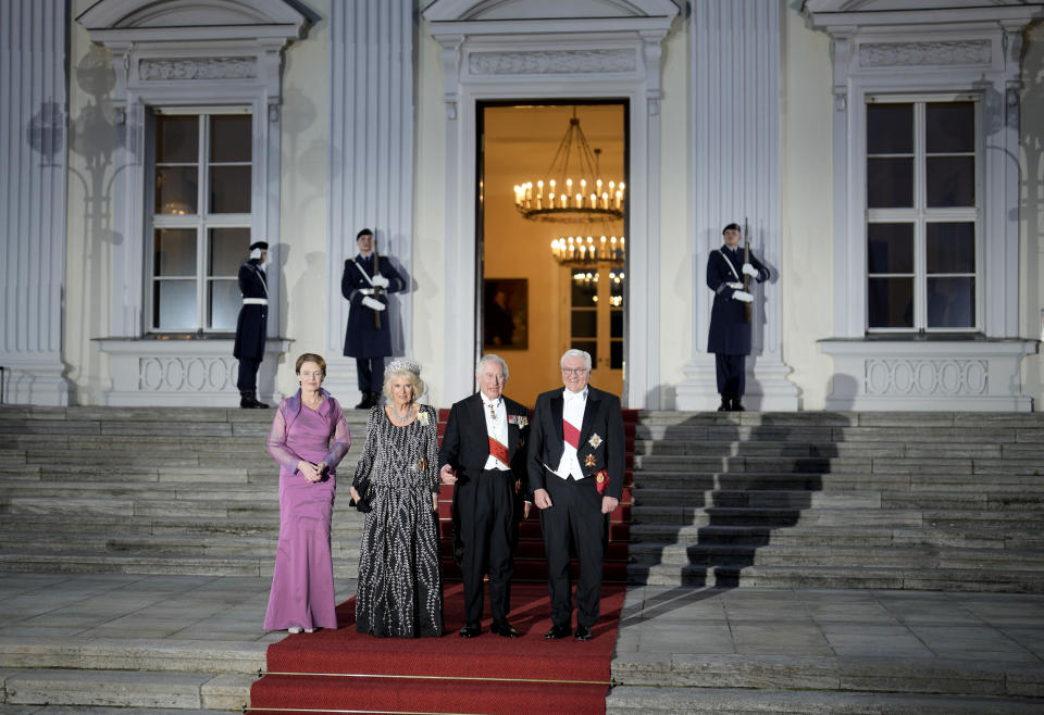 German President Frank-Walter Steinmeier, right, his wife Elke Buedenbender, left, Britain's King Charles III, 2nd right, and Camilla, the Queen Consort, stand in front of the Bellevue Palace in Berlin, Wednesday, March 29, 2023. King Charles III arrived Wednesday for a three-day official visit to Germany. (AP Photo/Markus Schreiber)