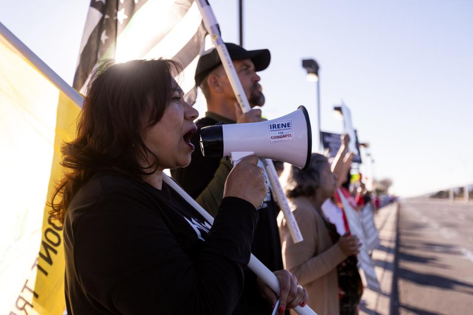 El Pasoans join Irene Armendariz-Jackson at the El Paso County Migrant Services Center to protest President Biden's visit to the borderland Sunday, Jan. 8, 2023.