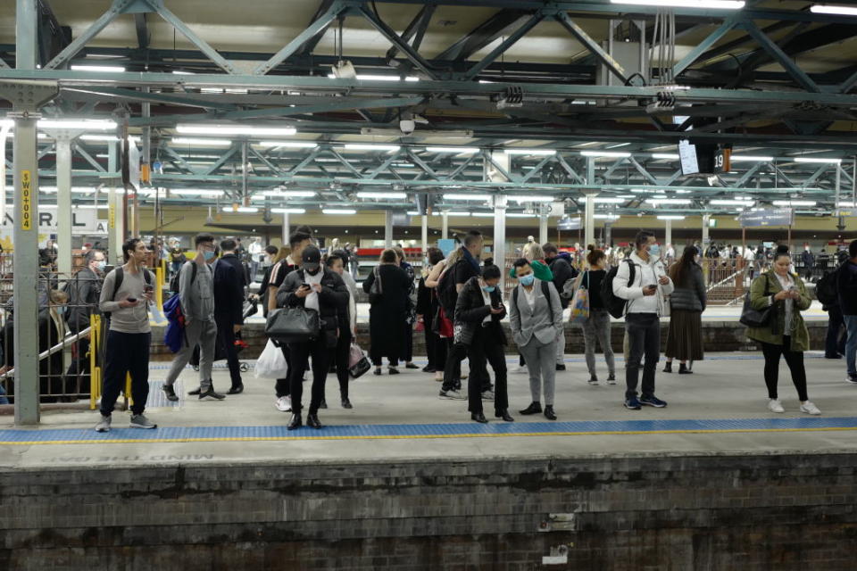 Commuters wear masks on Thursday as part of new restrictions enforced for transport. Source: Getty