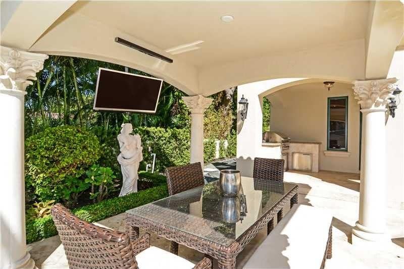 <p>Or sit on the patio by the pool. (Realtor.com) </p>