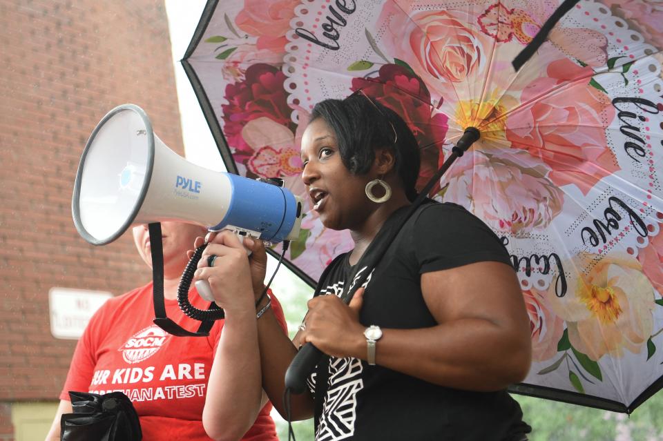 Domonica Bryan speaks at a rally against the Tennessee Comprehensive Assessment Program in Market Square on July 15, 2023.