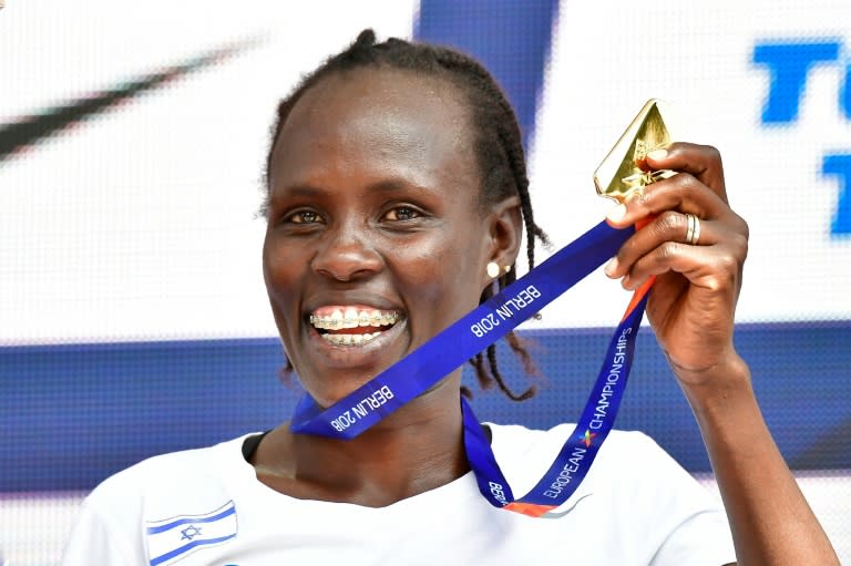 Winner Israel's Lonah Chemtai Salpeter poses on the podium with her medal during the medal ceremony of the 10000m women's event during the European Athletics Championships in Berlin on August 9, 2018