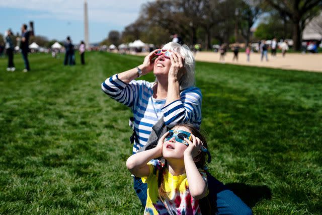 <p>Kent Nishimura/Getty</p> The eclipse in Washington, D.C.