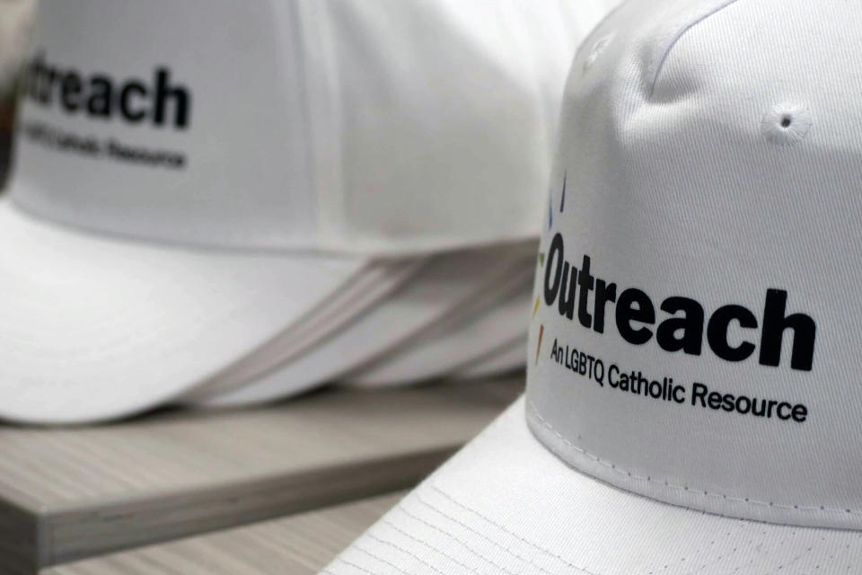 In this photo provided by America Media, branded hats are displayed during the Outreach conference at Fordham University's Lincoln Center campus in New York, June 16, 2023. (Cristobal Spielmann/America Media via AP)