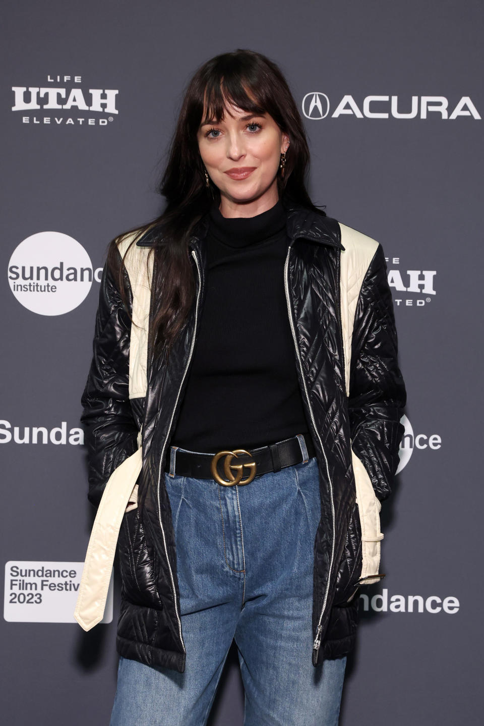 Close-up of Dakota at a media event in a jacket and jeans