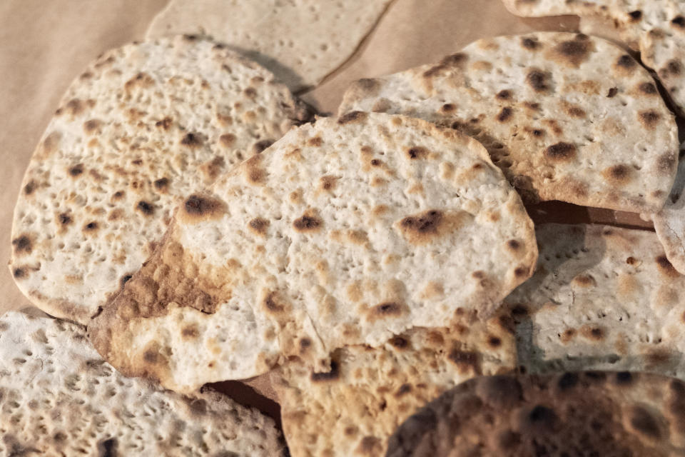 Freshly baked handmade matzo is seen after being prepared by first graders from Milton Gottesman Jewish Day School of the Nation's Capital, during a "Model Matzah Factory" event with Rabbi Levi Raskin, at the JCrafts Center for Jewish Life and Tradition in Rockville, Md., Thursday, April 18, 2024, ahead of the Passover holiday which begins next Monday evening. (AP Photo/Jacquelyn Martin)