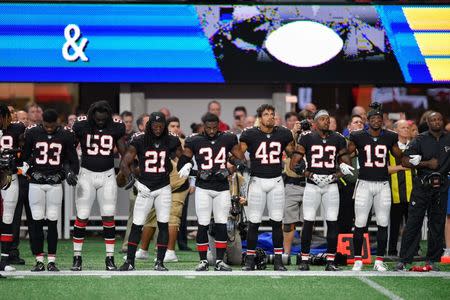 Oct 1, 2017; Atlanta, GA, USA; Atlanta Falcons players shown during the National Anthem prior to the game against the Buffalo Bills at Mercedes-Benz Stadium. Mandatory Credit: Dale Zanine-USA TODAY Sports