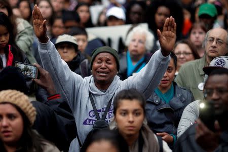 A demonstrator gestures during a protest against the police shootings that lead to two deaths in Louisiana and Minnesota, respectively, in Oakland, California, U.S. July 7, 2016. REUTERS/Stephen Lam