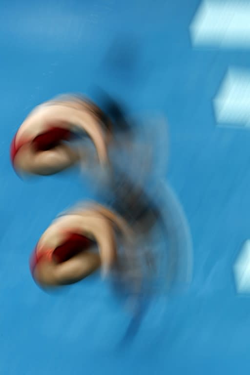 China's Wu Minxia and Shi Tingmao compete in the women's synchronized 3m springboard final on August 7, 2016