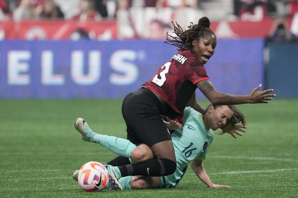 VANCOUVER, BRITISH COLUMBIA - DECEMBER 05: Kadeisha Buchanan #3 of Canada collides with Hayley Raso #16 of Australia during the second half at BC Place on December 05, 2023 in Vancouver, British Columbia. (Photo by Christopher Morris/Getty Images)