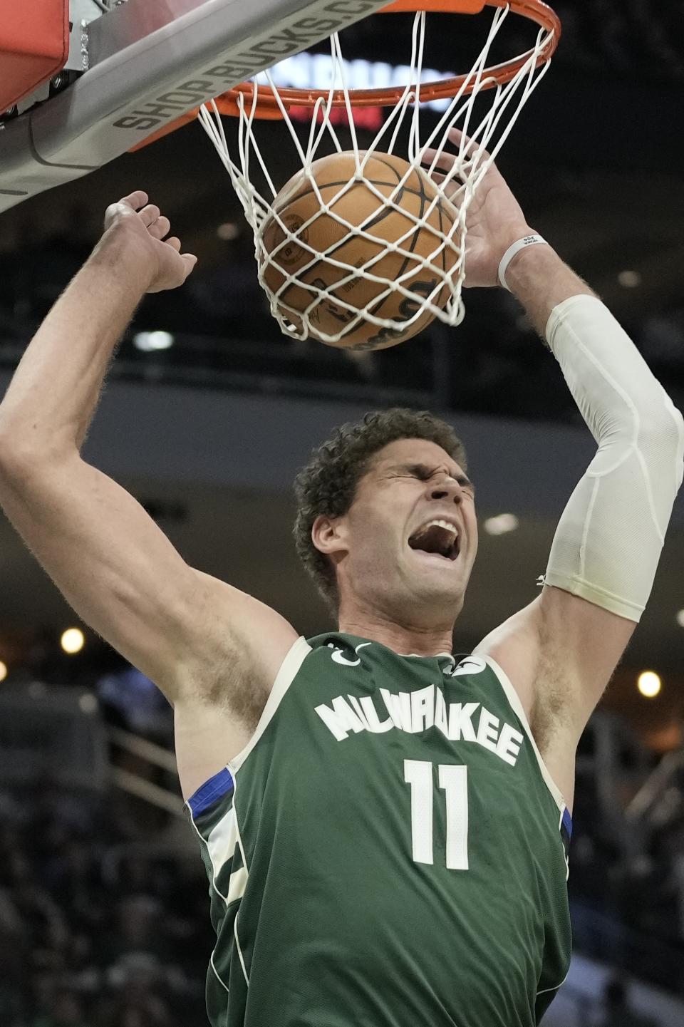 Milwaukee Bucks' Brook Lopez dunks during the second half of an NBA basketball game against the Toronto Raptors Tuesday, Jan. 17, 2023, in Milwaukee. The Bucks won 130-122. (AP Photo/Morry Gash)