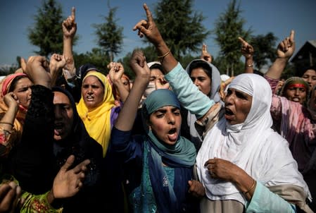 Kashmiri women attend a protest after Eid-al-Adha prayers at a mosque during restrictions after the scrapping of the special constitutional status for Kashmir by the Indian government, in Srinagar