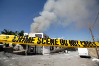 <p>A police crime scene cordon tape is seen outside a community hall where Saudi-led warplanes struck a funeral in Sanaa, the capital of Yemen on Oct. 9, 2016. (Khaled Abdullah/Reuters)</p>