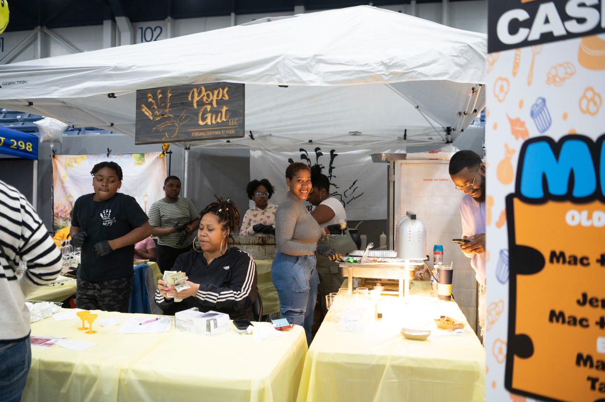 Staff with Pops Gut sell mac and cheese during The Big Cheese Mac and Cheese Festival at Kellogg Arena on Saturday, April 20, 2024.