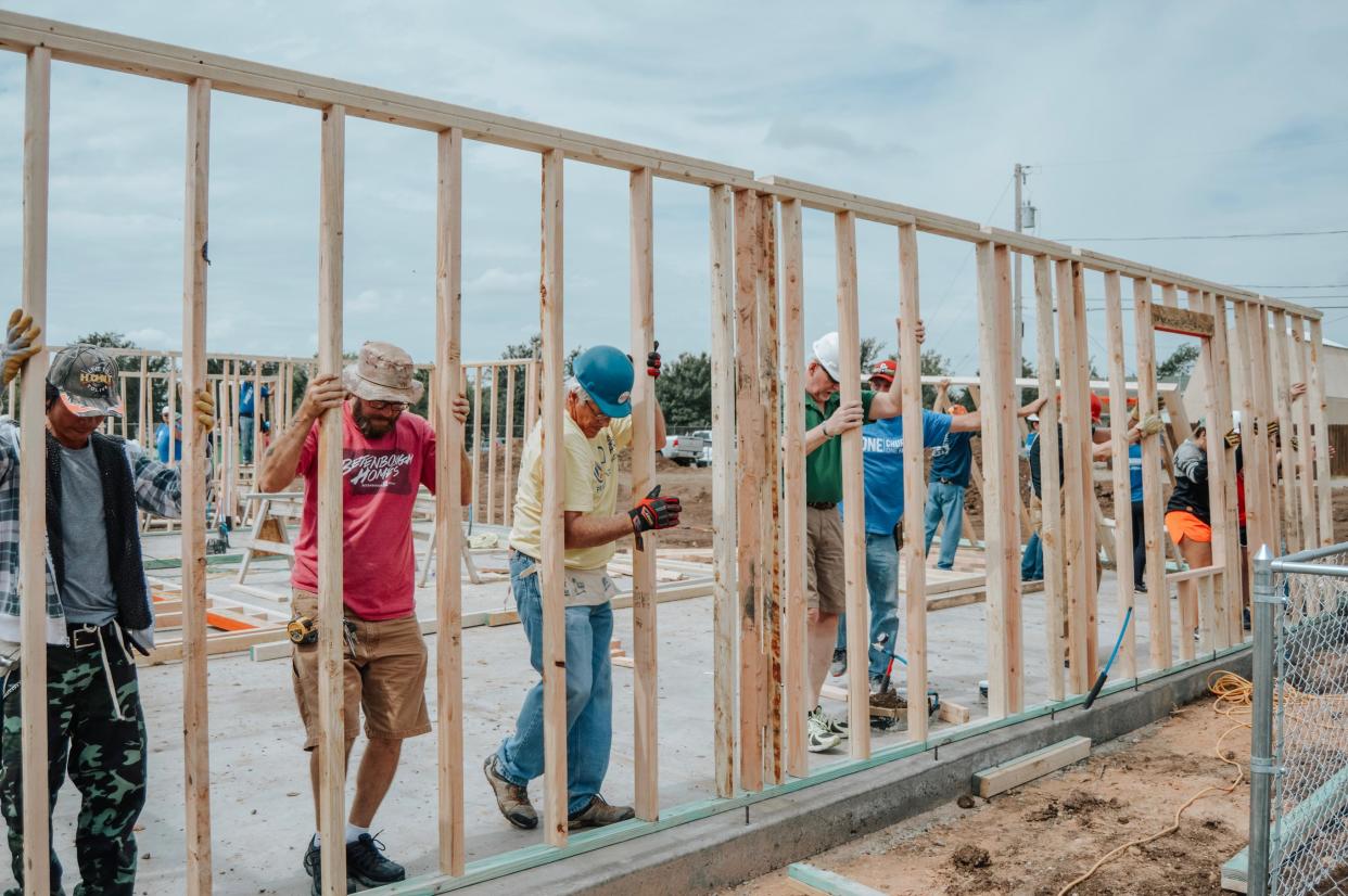 Volunteers with Amarillo Habitat for Humanity installing walls for one of the 115 home created by the organization over the past 40 years, as seen in this December 2021 file photo.