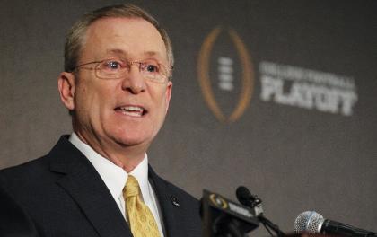 Jeff Long, College Football Playoff selections committee chairman, discusses the selection process of the semifinal pairings and semifinal bowl assignments during a news conference Sunday, Dec. 7, 2014, in Grapevine, Texas. (AP Photo/Tim Sharp)