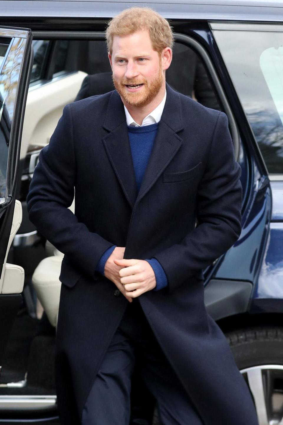 Prince Harry steps out of the car followed by his fiancee Meghan Markle in Cardiff