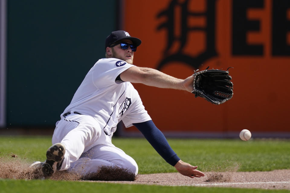 Detroit Tigers right fielder Austin Meadows misplays the ground rule double hit by Toronto Blue Jays' Santiago Espinal during the eighth inning of a baseball game, Sunday, June 12, 2022, in Detroit. (AP Photo/Carlos Osorio)