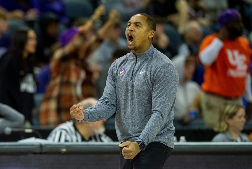 Evansville head coach David Ragland celebrates on the sideline as the University of Evansville Purple Aces play the Miami (Ohio) University Redhawks at the Ford Center in Evansville, Indiana, Monday, Nov. 6, 2023.