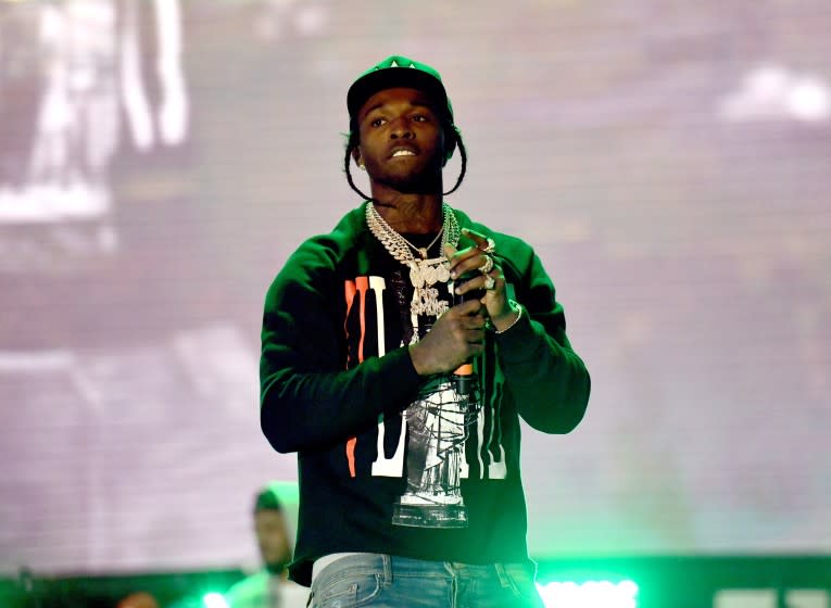 Rapper Pop Smoke performs onstage during the Rolling Loud Festival at Banc of California Stadium.