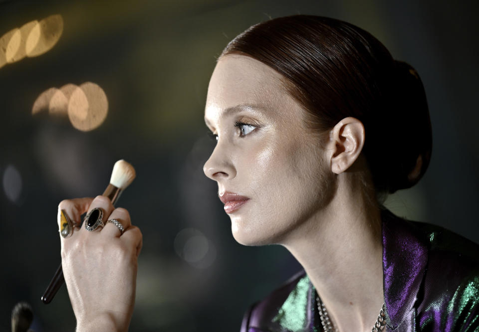 A model getting makeup applied backstage at the Christian Siriano Fall/Winter 2024 fashion show at The Plaza Hotel during New York Fashion Week on Thursday, Feb. 8, 2024, in New York. (Photo by Evan Agostini/Invision/AP)