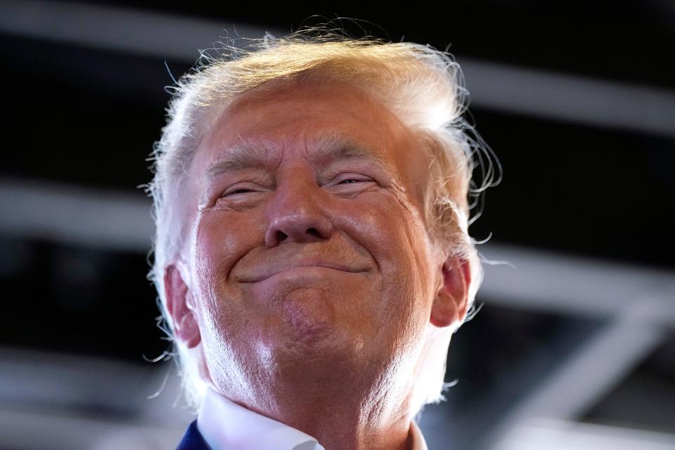 Republican presidential candidate former President Donald Trump reacts as he speaks to supporters during a visit to the Iowa State Fair, Saturday, Aug. 12, 2023, in Des Moines, Iowa. (AP Photo/Charlie Neibergall)