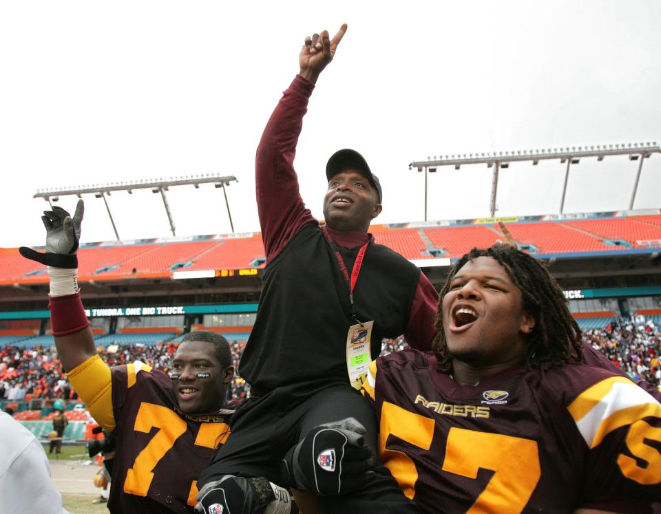 Glades Central head coach Willie Snead is carried off the field by Jatavious Jackson (77) and Ernest McCoy (57) after the Raiders won the Class 3A state football championship by beating Pine Forest, 39-27, in 2006.