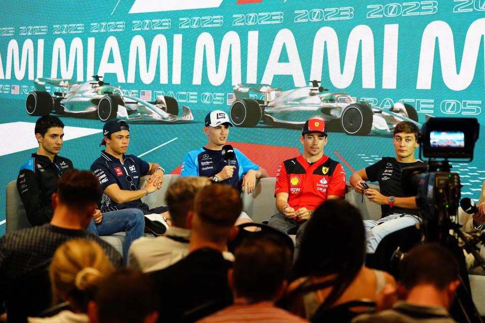 Williams driver Logan Sargeant (center) of the United States talks to reporters Thursday during a breakout media session at Miami International Autodrome in Miami Gardens.