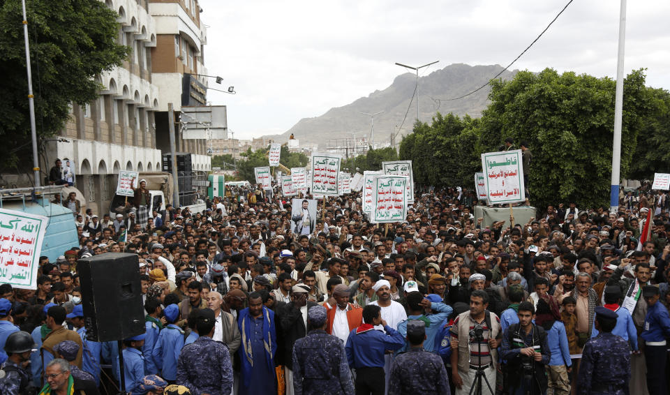 Houthi supporters chant slogans as they attend a rally marking eight years for a Saudi-led coalition, Friday, March 26, 2023, in Sanaa, Yemen. (AP Photo/Hani Mohammed)