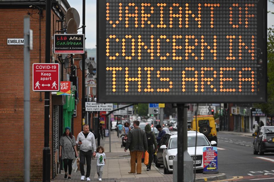 <p>Public health digital board warns the public of a Covid-19 variant of concern affecting the community in Bolton</p> (AFP via Getty Images)