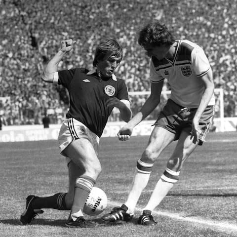 1980: Scotland v England at Hampden Park. Kenny Dalglish beats his club mate Phil Thompson to the ball.  - Credit: Getty