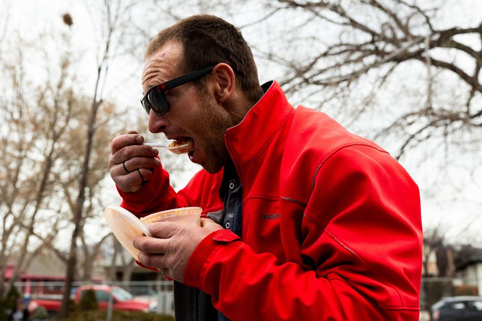 Matthew Andrus Hunter eats jambalaya from Be a Little Too Kind in Salt Lake City on Thursday, Feb. 1, 2024. Be a Little Too Kind is a nonprofit organization focused on assisting homeless people by providing a homemade meal every week and other essential life sustaining items. | Megan Nielsen, Deseret News