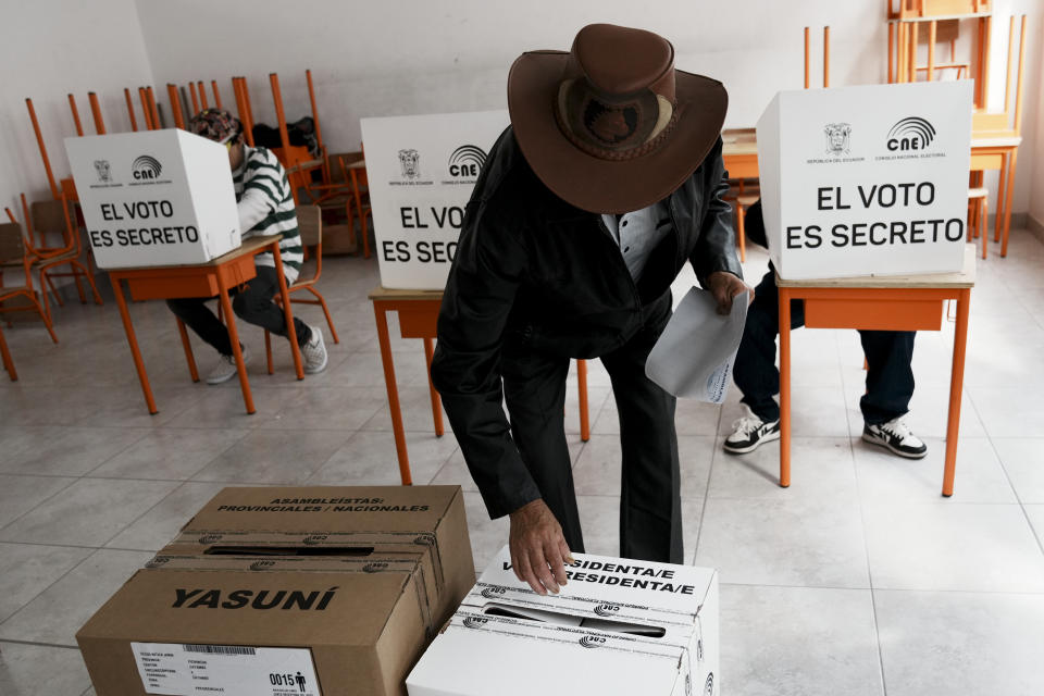 A man votes in a snap presidential election in Cayambe, Ecuador, Sunday, Aug. 20, 2023. The special election was called after President Guillermo Lasso dissolved the National Assembly by decree in May to avoid being impeached. (AP Photo/Dolores Ochoa)