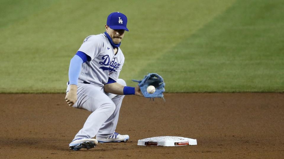 Kiké Hernández takes a throw to second base during a baseball game against the Arizona Diamondbacks on Aug. 2 in Phoenix.