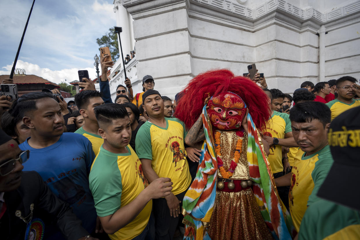 The Lakhe, a demon adored for divine might, performs during Indra Jatra, a festival that marks the end of the rainy season in Kathmandu, Nepal, Tuesday, Sept. 17, 2024. (AP Photo/Niranjan Shrestha)