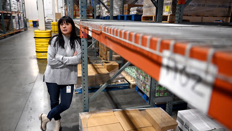 Heidi Cannella, communications director for the Utah Food Bank, talks about the products and items available for those that need them, at the food bank’s South Salt Lake warehouses on Thursday, Dec. 28, 2023.