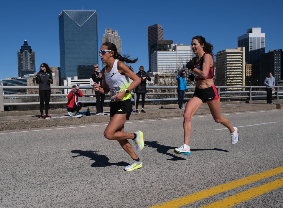 ATLANTA, GEORGIA - FEBRUARY 29:  Des Linden and Laura Thweatt race during the U.S. Olympic marathon team trials on February 29, 2020 in Atlanta, Georgia. (Photo by Andy Kiss/Getty Images)