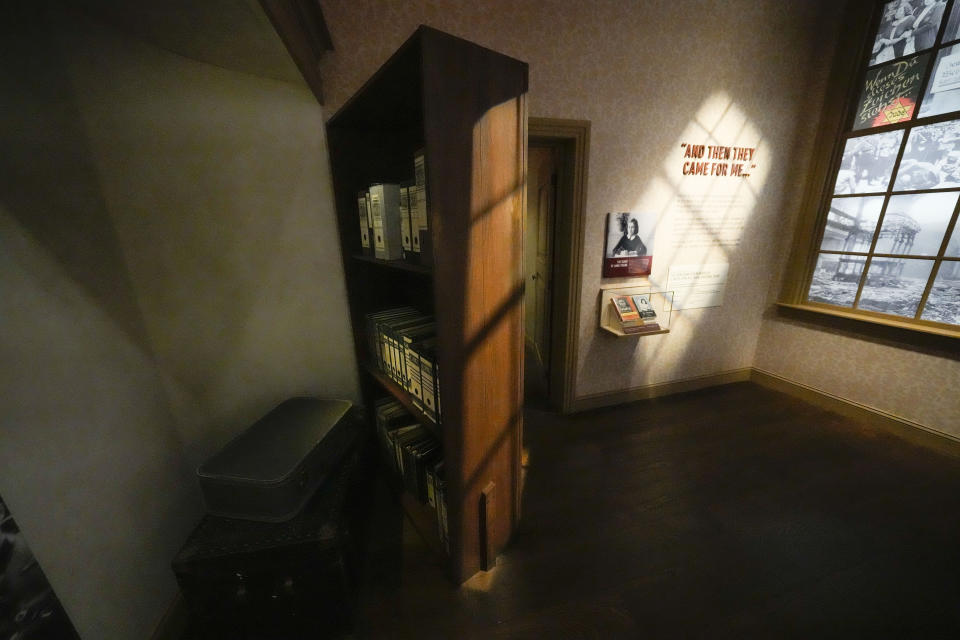 A bookcase revealing a secret hiding place is part of a replica of the home in Amsterdam where Anne Frank hid, in the new pavilion opening at the National World War II Museum in New Orleans, Tuesday, Oct. 31, 2023. The latest major addition to the museum is called the Liberation Pavilion. And it's ambitious in scope. The grim yet hopeful addition addresses the conflict's world-shaping legacy. (AP Photo/Gerald Herbert)