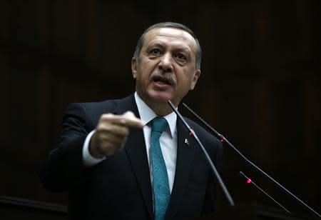 Turkey's Prime Minister Tayyip Erdogan addresses members of the parliament from his ruling AK Party (AKP) during a meeting at the Turkish parliament in Ankara February 11, 2014. REUTERS/Umit Bektas
