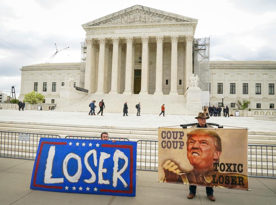 Protestors gather outside of the U.S. Supreme Court as the justices hear oral arguments on whether former President Donald Trump is immune from criminal charges in his federal election interference case.