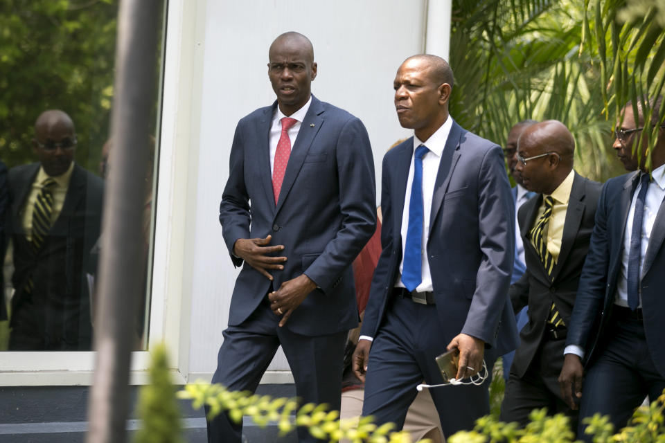 FILE - In this March 21, 2019 file photo, Haiti's President Jovenel Moise, from left, Special Advisor Jose Daniel Joseph and Communications Minister Jean-Michel Lapin, who was named interim prime minister, arrive for Lapin's presentation ceremony, in Port-au-Prince, Haiti. The country's largest opposition groups have united in a campaign to push U.S.-backed Moise from office with nationwide protests aimed at paralyzing the country starting on Friday, March 28, 2019. Lapin said that the government encouraged peaceful demonstrations but would not allow violence on the streets. ( AP Photo/Dieu Nalio Chery)